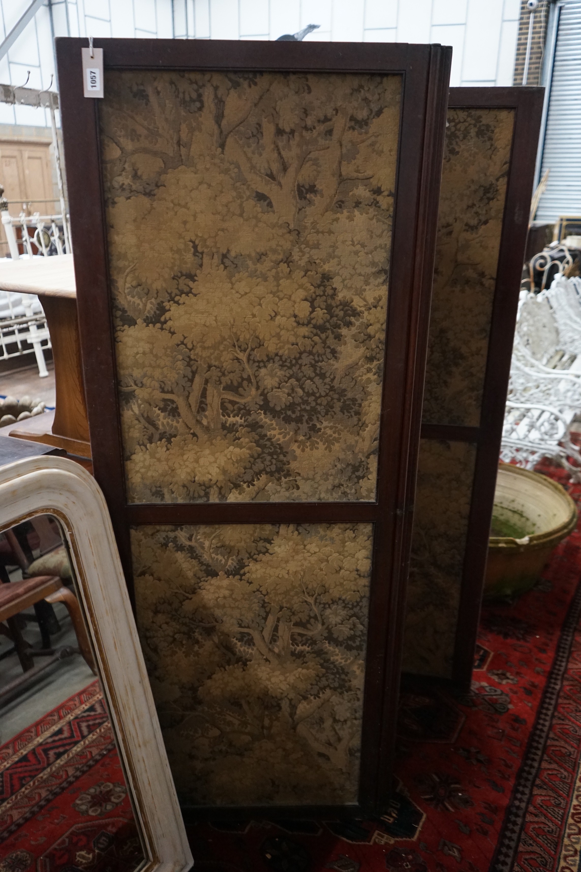 An early 20th century mahogany three fold dressing screen inset tapestry panels, each panel width 62cm, height 168cm
